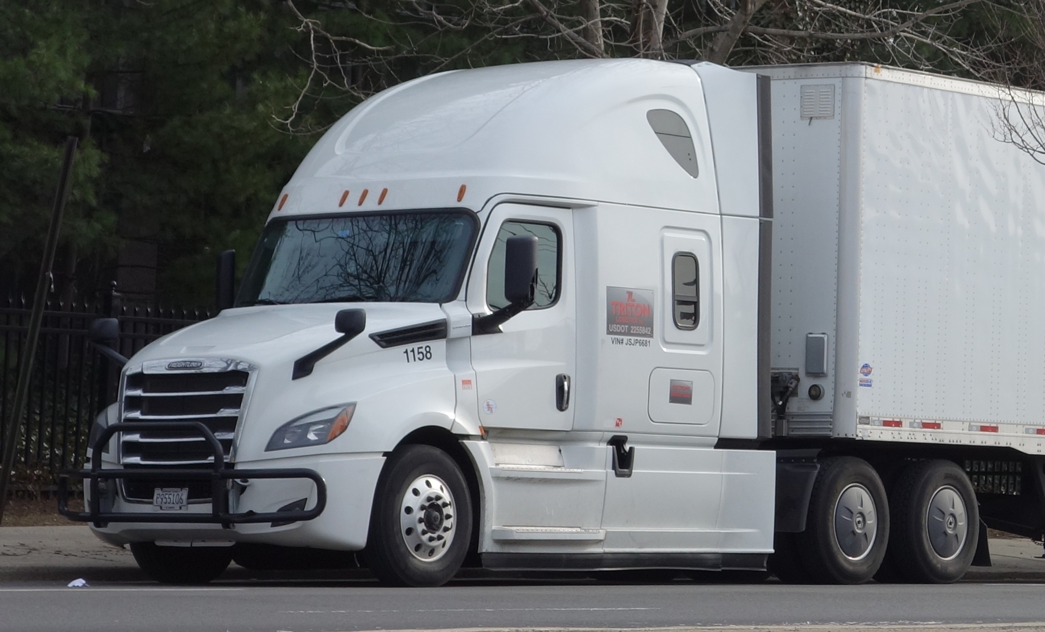 Freightliner Cascadia hauling a dry van trailer
